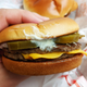 hand holding jalapeno mcdouble